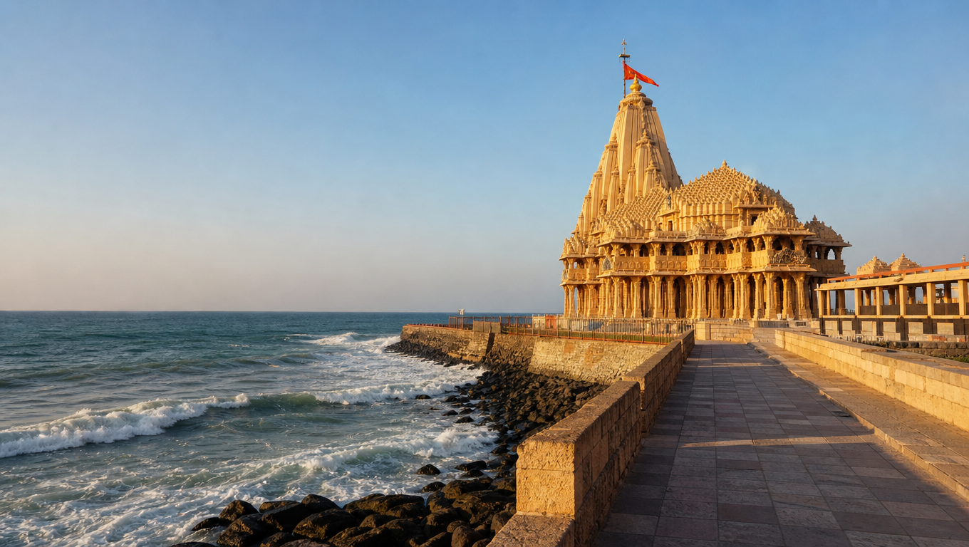 Somnath Temple's tall shikhara on the Gujarat shore with the Arabian Sea behind in late afternoon light.